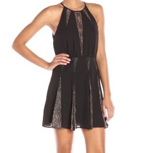 BCBG black “Teena” lace inserts halter cocktail dress.